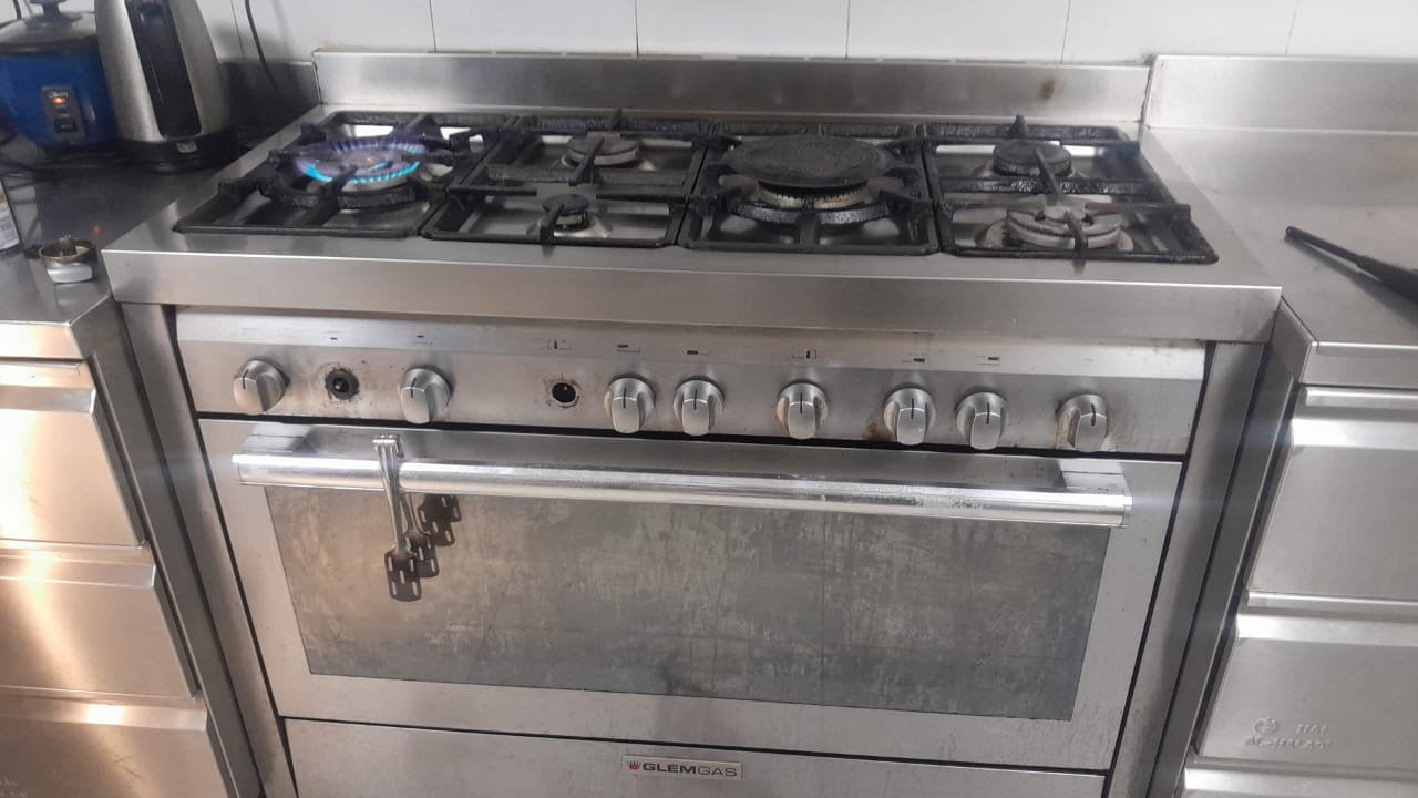 Gas range burner flame test after repair