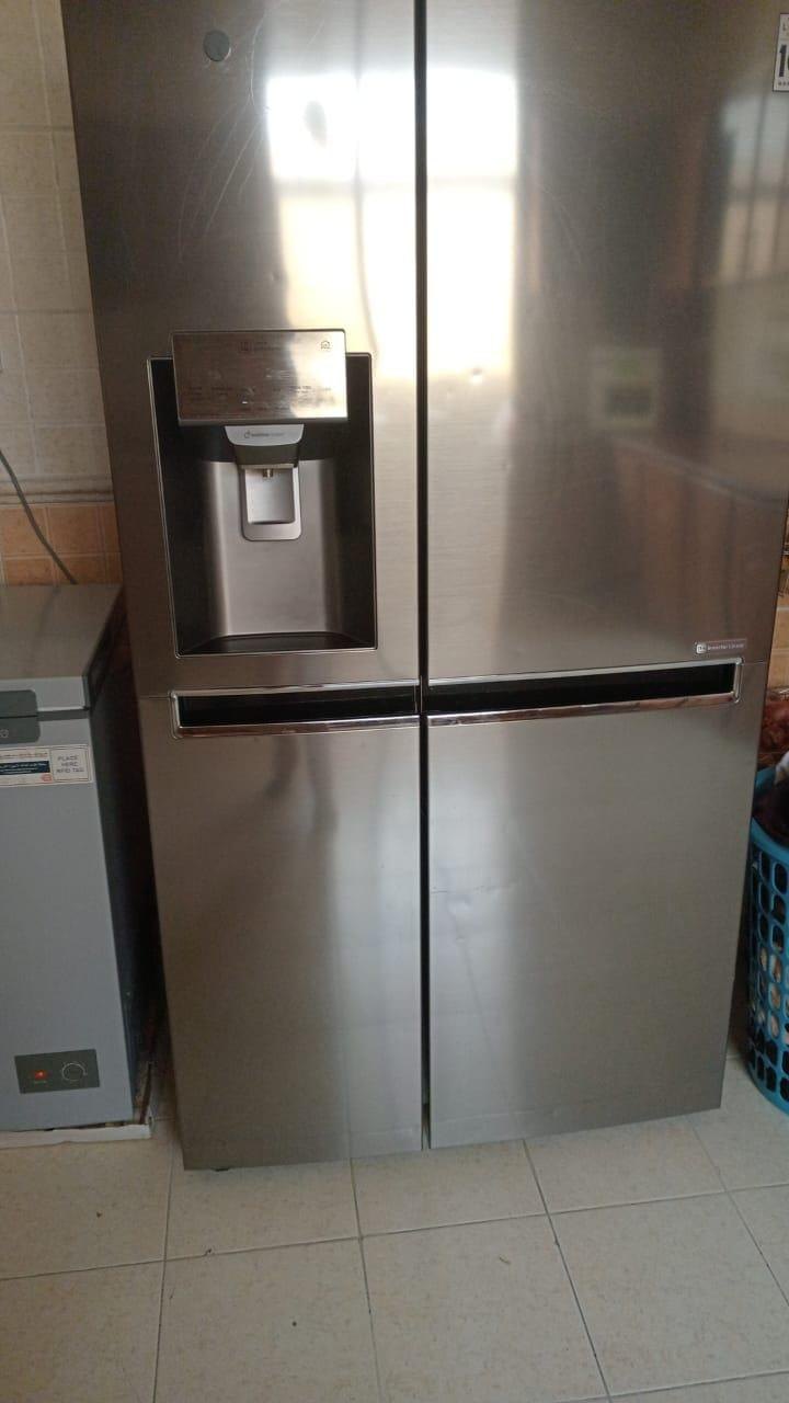 Multi-door refrigerator with an ice and water dispenser on a UAE service call