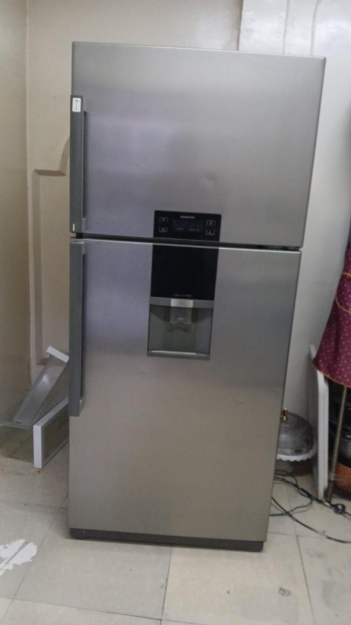 Top-mount refrigerator with a water dispenser attended in a UAE home